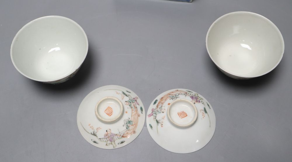 A pair of Chinese famille rose bowls and covers, late 19th century, a blue and white box and cover, 11cm and an eggshell bowl, 8cm